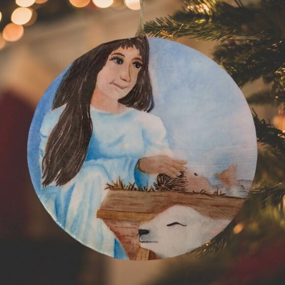 Blessed Mother Mary and Jesus ornament with Christmas tree background