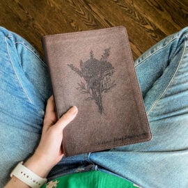 A ESV Journaling by Crossway Publishing in Dark Brown. It has a design of a Flower Bouquet engraved on it. It is hand lettered with calligraphy and makes a beautiful Christian gift, Gods Word, Scripture, 9781433568749