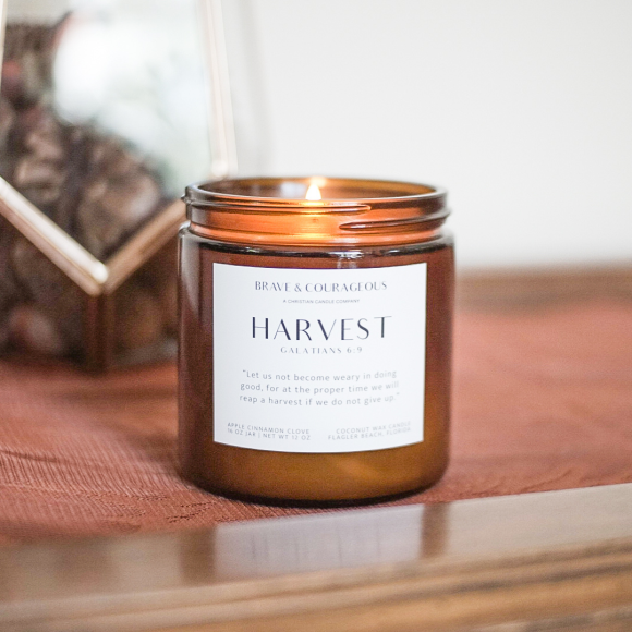 Discover the Harvest Candle, a fall favorite with scents of apple, cinnamon, clove, and nutmeg. This Christian candle, paired with Galatians 6:9, is perfect for cozy autumn days, Bible verse gifts, and fall decor. Made with clean coconut wax for a long-lasting burn.