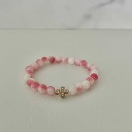 Pink white marble cross bracelet, handmade Christian jewelry, features a gold cross charm, perfect faith-inspired gift or daily accessory.