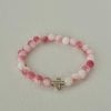 Pink white marble cross bracelet, handmade Christian jewelry, features a gold cross charm, perfect faith-inspired gift or daily accessory.