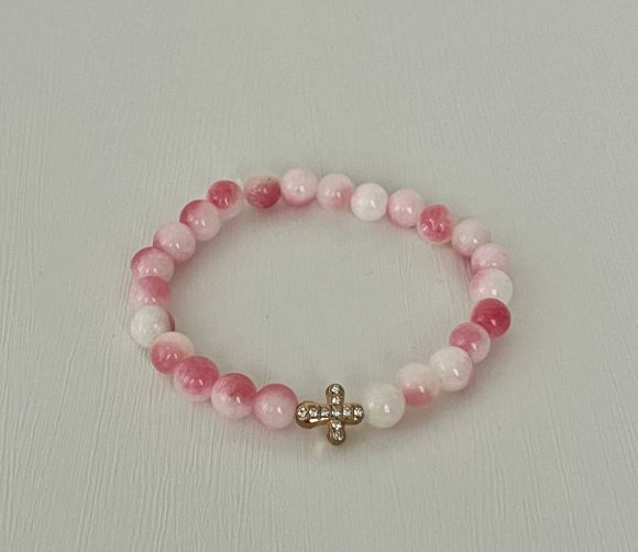 Pink white marble cross bracelet, handmade Christian jewelry, features a gold cross charm, perfect faith-inspired gift or daily accessory.