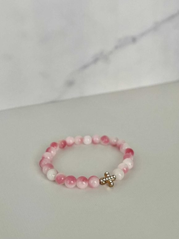 Pink white marble cross bracelet, handmade Christian jewelry, features a gold cross charm, perfect faith-inspired gift or daily accessory.