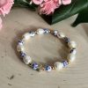 Floral pearl cross bracelet for Christian women – handmade faith jewelry with freshwater pearls and flower beads, religious gift idea